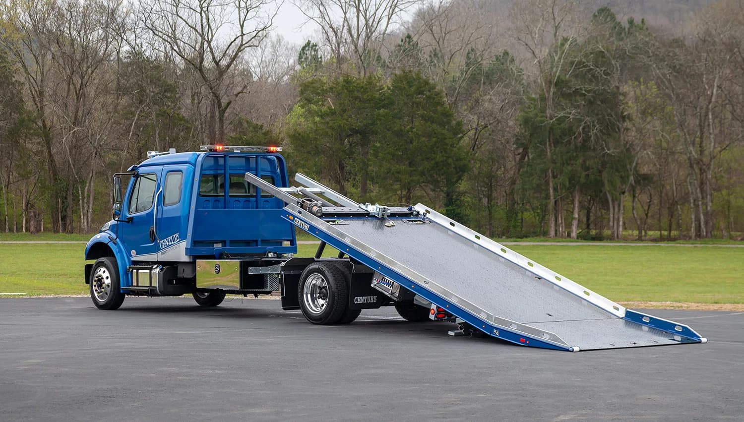 Miller Industries blue Century 12 Series LCG car carrier